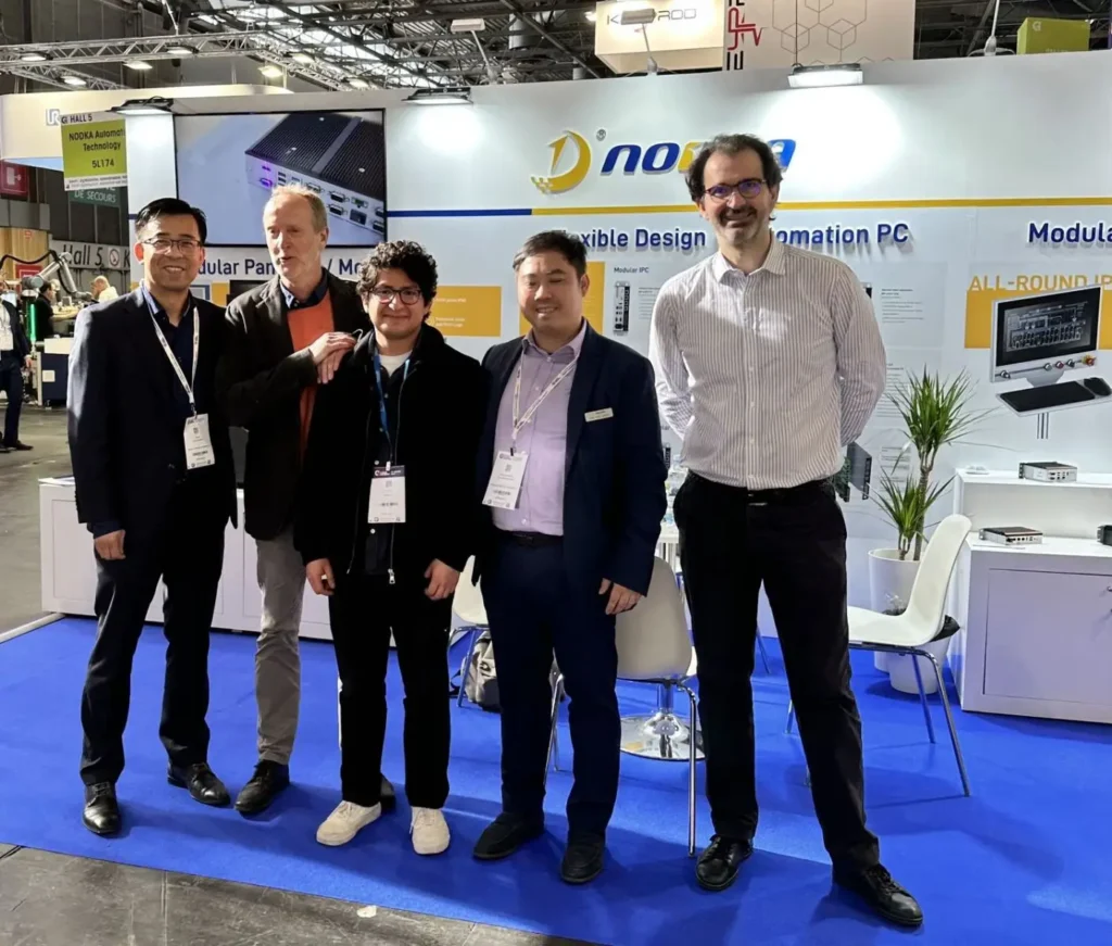 Nodka team members posing at Global Industrie trade fair booth