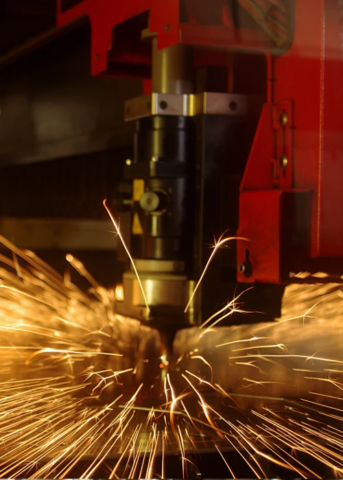 automated laser cutting process in industrial metal fabrication environment