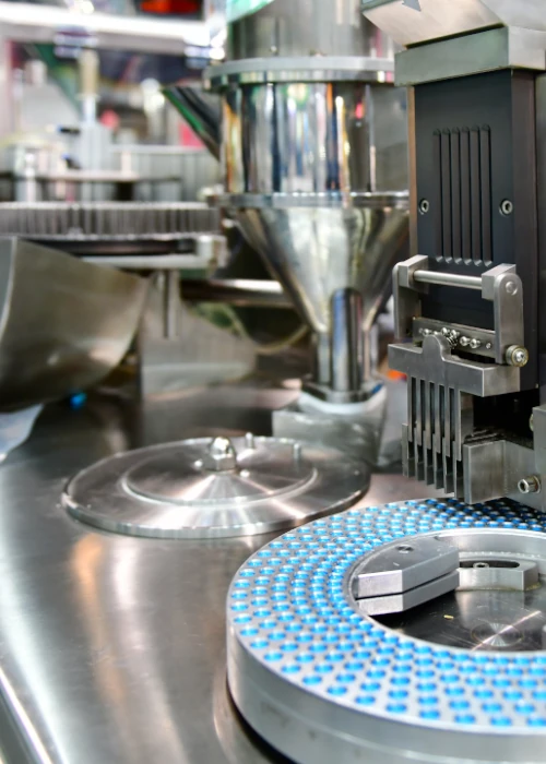 Stainless steel industrial processing equipment in automated production facility